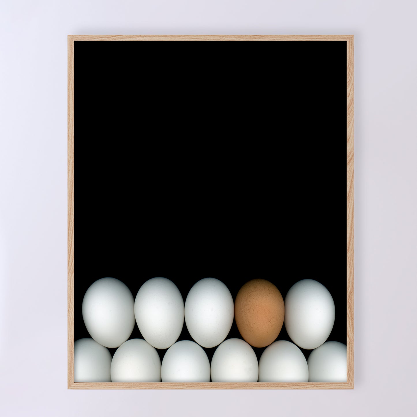 Two rows of white chicken eggs with one brown egg on a black background. Open edition 8x10 inches print by Carmen Grenier. OE-354-1
