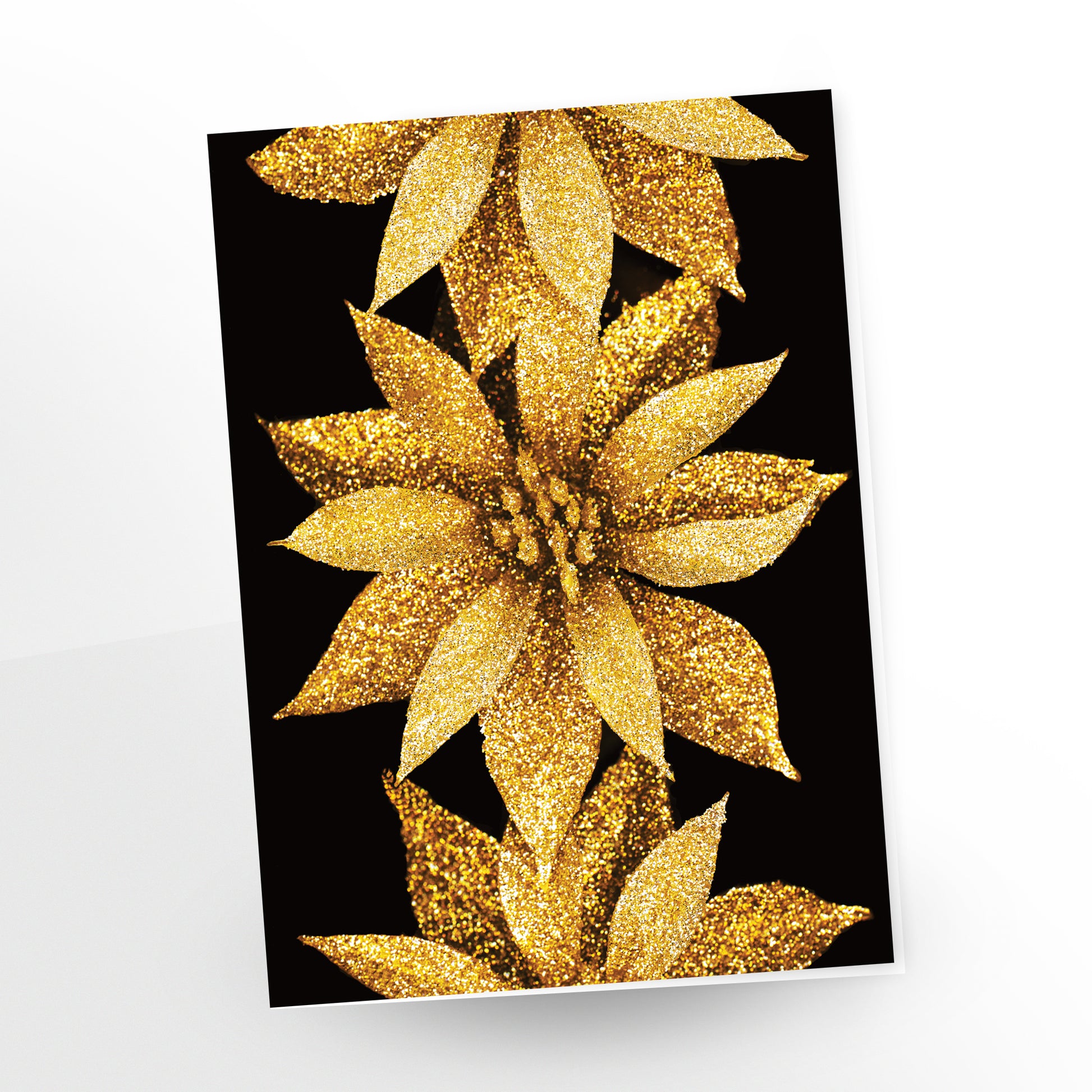 Happy Holidays 'Golden Hour" greeting card. Three sparkling gold poinsettias on a black background add a touch of elegance to your holiday wishes.