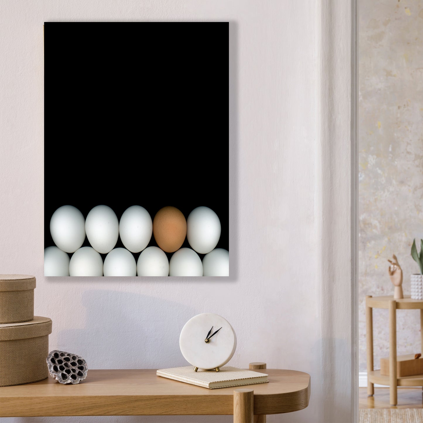 Two rows of white chicken eggs with one brown egg on a black background open edition print in home setting. Open edition 8x10 inches print by Carmen Grenier. OE-354.