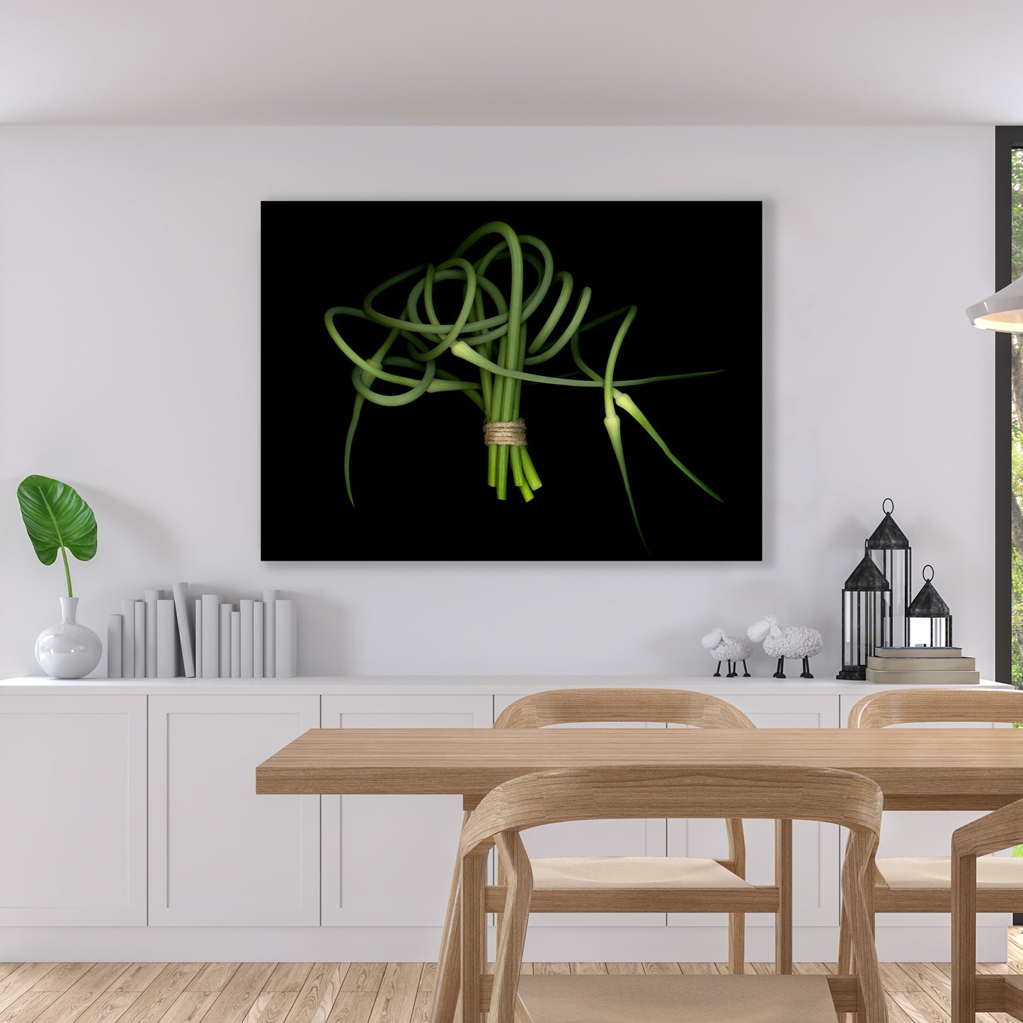 This fine art print features a detailed bouquet of garlic scapes on a black background. The print is showcased in a dining setting and has the code OE-362. The image was created using scanography by Carmen Grenier.