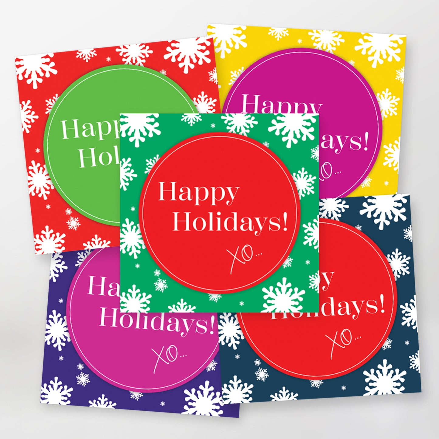 Set of five lively greeting cards with 'Happy Holidays!' XO text and white snowflakes on a colourful background.