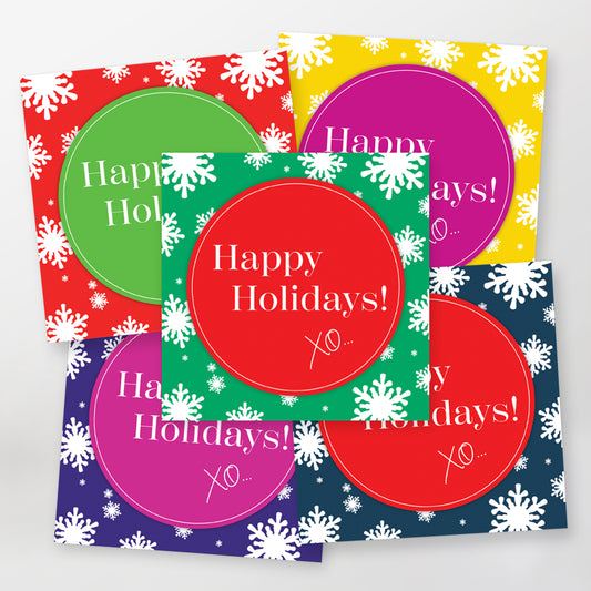 Set of five lively greeting cards with 'Happy Holidays!' XO text and white snowflakes on a colourful background.