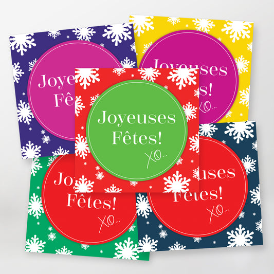 Colorful greeting cards with 'Joyeuses Fètes!' text and snowflake patterns. 